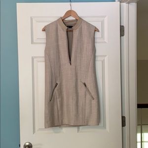 Tan dress with a zipper down the middle.